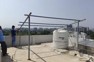 Technicians installing rooftop solar panels