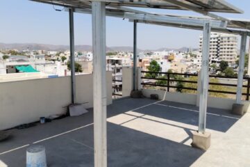 Technicians inspecting installed solar energy system
